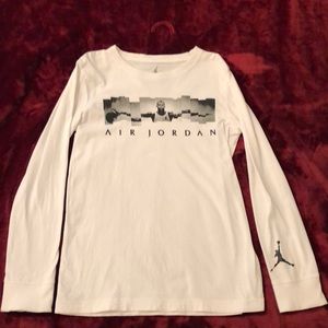 Boys white long sleeve Nike Air Jordan shirt.